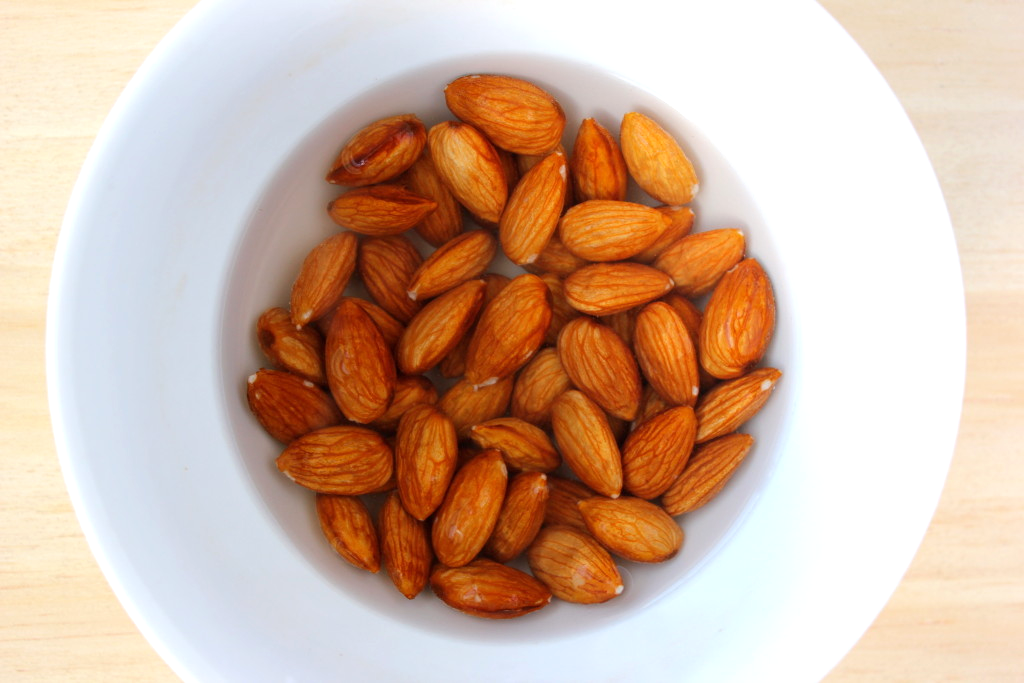 almonds soaking in a bowl of water 